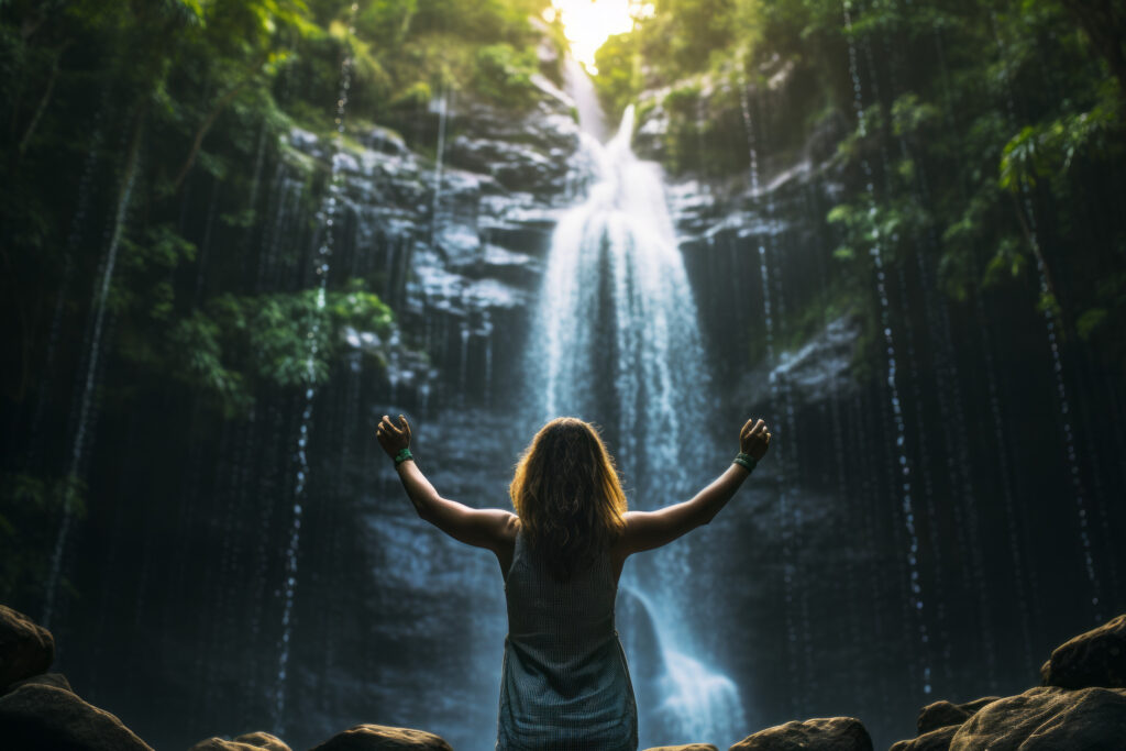 Embracing the Splendor: A Woman's Triumph Amidst Nature's Cascade